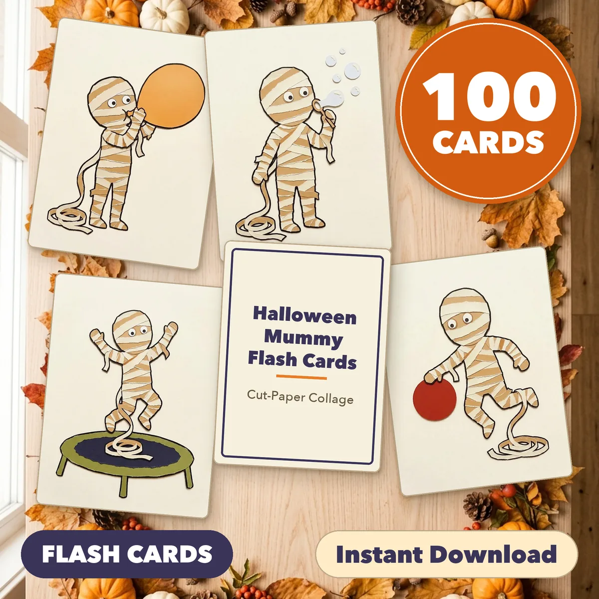 Four mummy cards fanned around a title card on a light table, under a round badge reading 100 CARDS, with the labels Print and Cut and Instant Download.